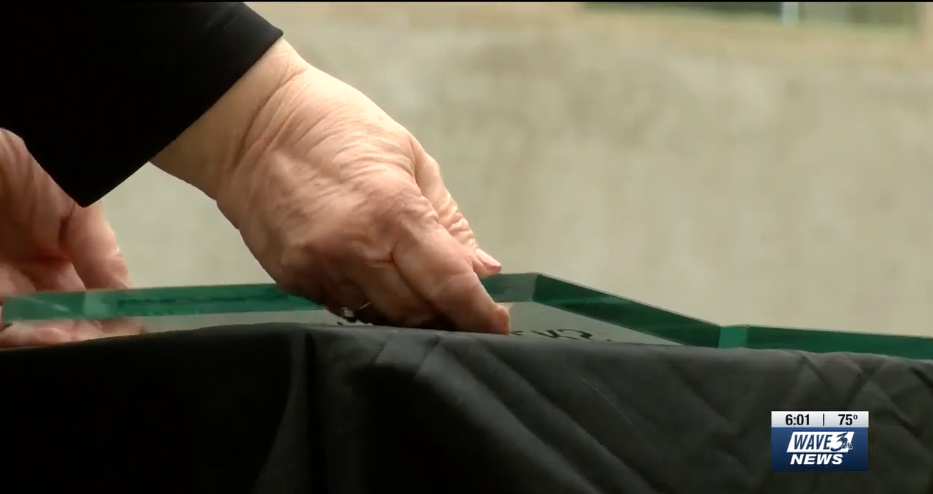 Family member holds glass block