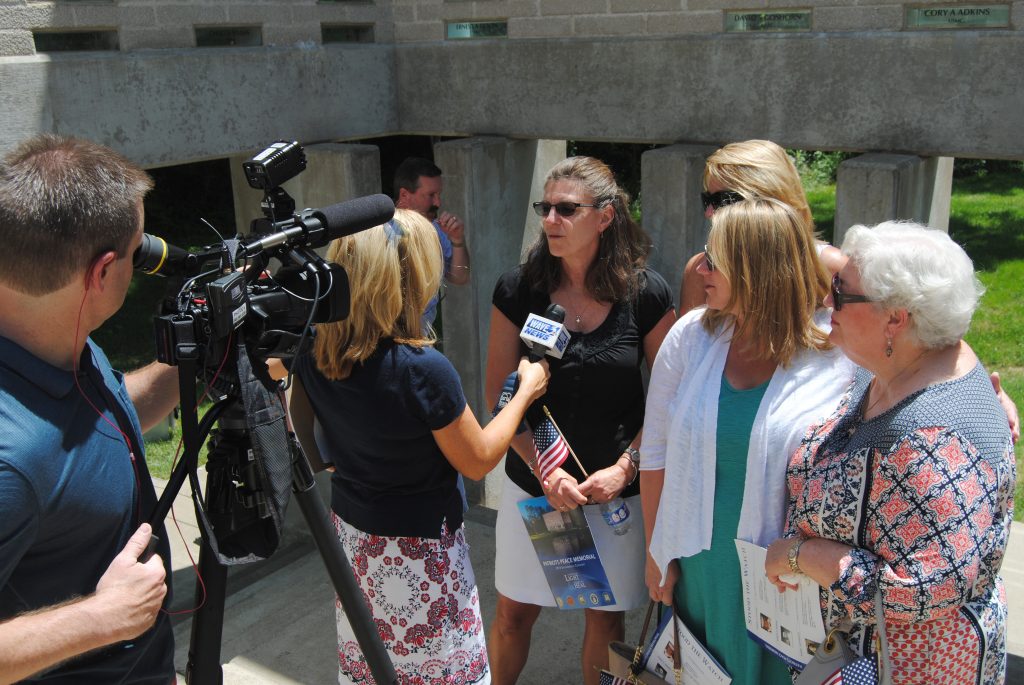 Loved ones talking to the press during memorial