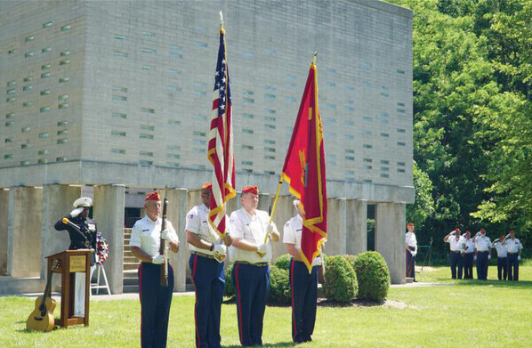 Servicemen holding flags 