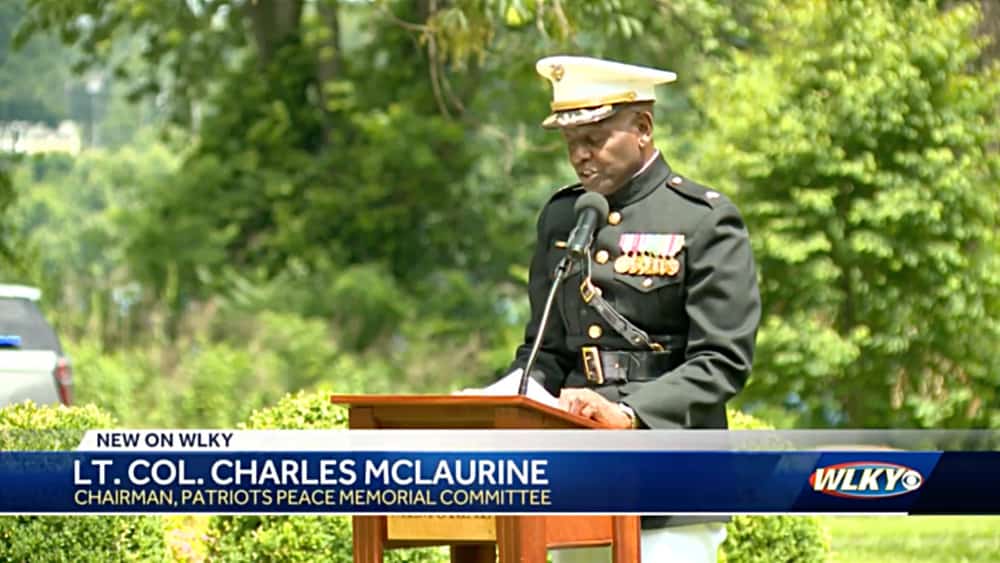 Col Charles McLaurine talking during ceremony